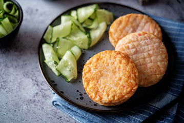 Shrimp patties with cucumber in a plate