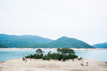 Fototapeta na wymiar Small island in High Island Reservoir, Hong Kong Geological Park, outdoor