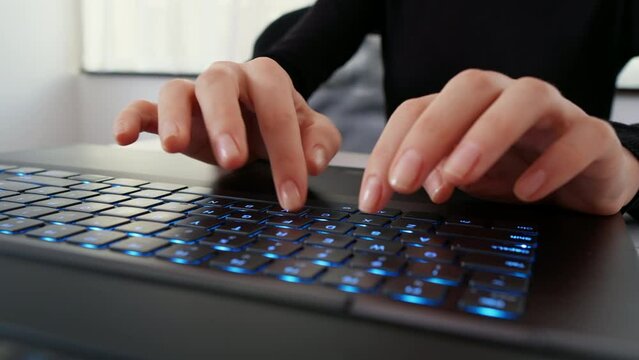 Female hands texting on laptop keyboard close up. Busy business woman emailing use digital wireless portable device. Office work, software, online education, apps, modern tech concept.