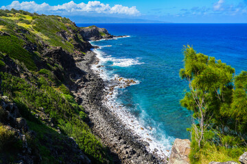 Aerial view of the cliffs of Lipoa Ridge above the Pacific Ocean along the Honoapiilani Highway in West Maui, Hawaii, United States
