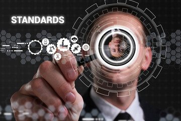 Business, technology, internet and network concept. Young businessman thinks over the steps for successful growth: Standards