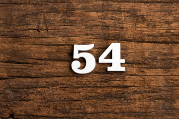Number 54 - piece on rustic wood background