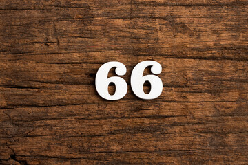 Number 66 - piece on rustic wood background
