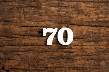 Number 70 - piece on rustic wood background