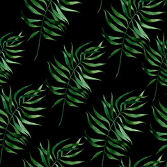 Seamless pattern of green tropical palm leaves on a black background. It is well suited for designer wallpaper, fabric printing, wrapping paper, notebooks