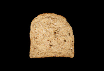 Isolated slice of multi seed bread against dark black background. Organic Multi wholegrain bread.  Healthier bread, healthier diet. Complex carbohydrates.