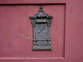 Historic cast iron mailbox (Portuguese Correio means post in English) on the house wall of an old building in Manaus, Amazonas – Brazil