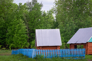 Wooden gazebo and spring in the forest.