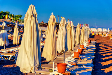 A beach cleared and ready for new day at the late afternoon of summer day in Antalya, Turkey.