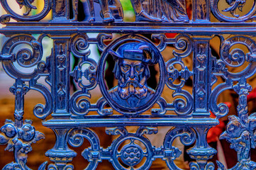 Metal made decorative composition representing a man from older times used as decoration at fence in Stockholm, Sweden.
