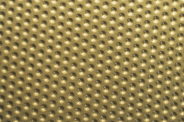 Golden textured pattern of the baking tin bottom. Seamless metal sheet as background