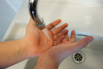 Obraz na płótnie Canvas hand wash and disinfection as hygienic measure