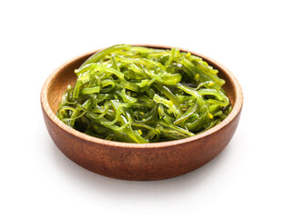 Plate with healthy seaweed salad on light background