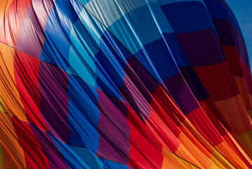 Close up images of a colorful hot air balloon.