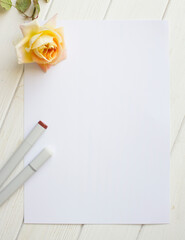 Mockup for A4 paper with single rose and drawing material