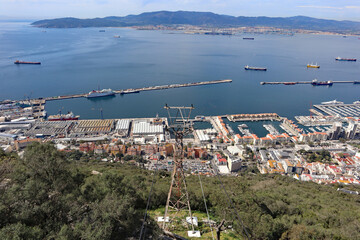 Panoramic view over Gibraltar harbour from the top of the Rock of Gibraltar. The airport runway...