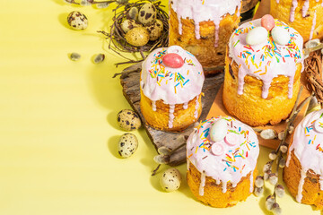 Traditional Easter cake. Festive sweet food with icing and decor. Eggs, nest, willow
