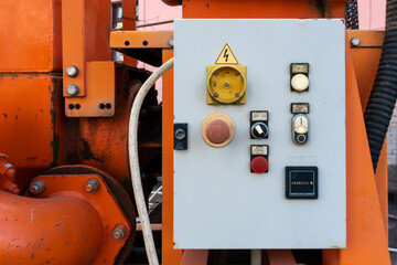 Dashboard with buttons and toggle switches at the pumping station for pumping groundwater.  Drainage works on the construction site. Pumping of groundwater from dug trenches