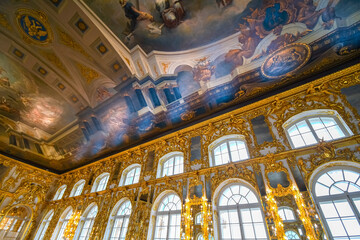 The painted ornate ceiling of the Great Hall inside the Rococo Catherine Palace at Pushkin...