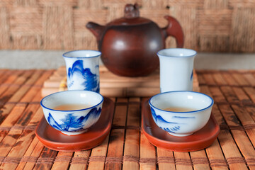tea set on a table with a bamboo substrate