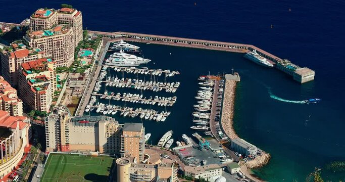 Aerial view of port Cap Dail at sunset, France, a lot of boats are moored in marina, view of city life from La Turbie mountain, mega yachts