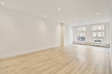 The interior of an open empty room in a studio apartment with a white decoration