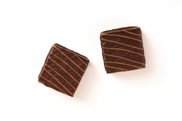 Layer cake with chocolate isolated on white background. Top view
