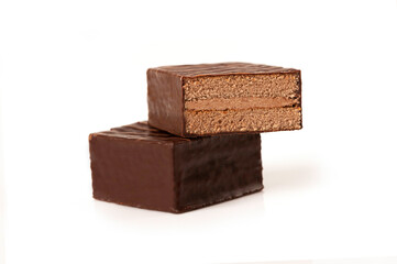Stack of chocolate layer cake isolated on white background.