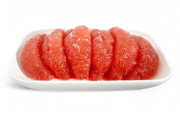 Red Pomelo or Grapefruit called Tabtim Siam in Thai, a sweet taste fruit with bright color planted in Asia, arranged beautifully on a white plate isolated on white background. Clipping path	
