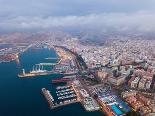 Panoramic view of coastline and city in Almeria on dusk, Spain - Powered by Adobe