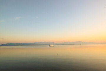 Beautiful Sunrise Sky With Ship in Toba Lake