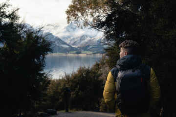 Man walking among the forest in Lake Hawea, South Island of New Zealand