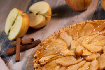 Delicious apple pie on a wooden table, from above