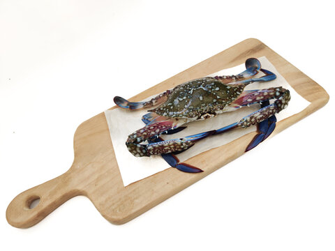 Asian Blue Swimming Crab decorated on a wooden pad,Selective focus
