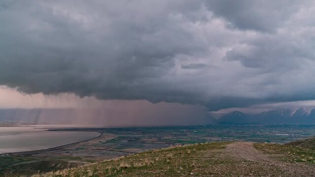 Utah Valley as heavy clouds and rainstorm move across the land viewing from West Mountain.