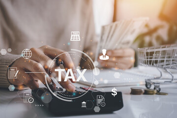 Woman accountant calculate and complete Individual income tax return form online for tax payment....