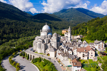 Picturesque summer view from drone of alpine township of Re with pilgrimage church of Virgin Mary...