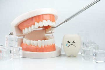 Tooth decay sensitive is crying with cold ice on white background ,Dental concept of tooth sensitivity from drinking cold water - obrazy, fototapety, plakaty