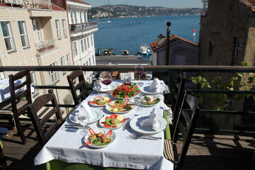 Turkish sea foods and Turkish appetizer foods on the restaurant table at Bosphorus in Istanbul, Turkey.