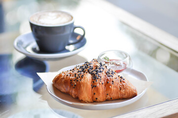 croissant , French croissant or French bread with sesame topping and coffee