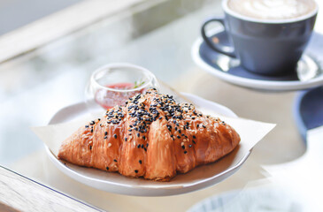 croissant , French croissant or French bread with sesame topping and coffee