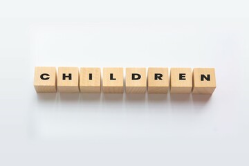 CHILDREN cube blocks on white background. Wooden blocks with the word CHILDREN. Children wood cube - Business Concept