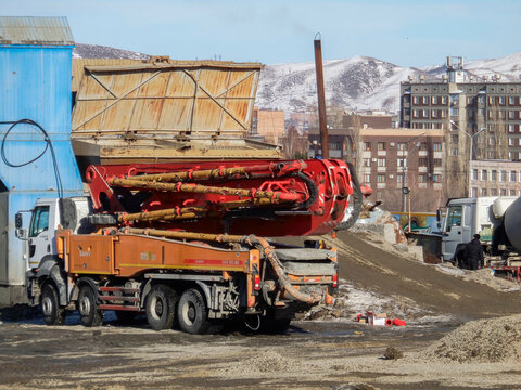 kazakhstan, Ust-Kamenogorsk, february 15, 2021: Trucks on the construction site. Construction engineering. Industrial background. New residential area