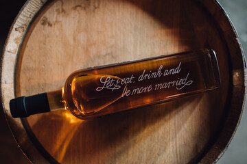 whiskey bottle etched with words 