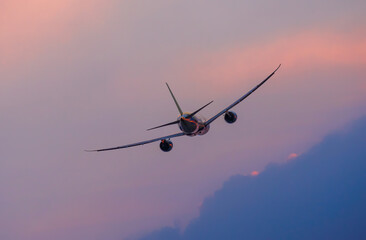Air transportation system used to transport people and goods by air. Fresh blue sky, colorful sky wide airplane, pink and pastel color of sky, sunlight and sunset view.