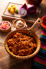 Cochinita Pibil. Typical Mexican stew from Merida, Yucatan, made from pork marinated with achiote and generally accompanied with beans and red onion with habanero chili, it can be eaten in tacos.