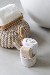 Fototapeta na wymiar Bathroom towels, massage body brush and eco friendly toiletries