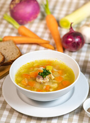 Fresh Vegetable soup in a white bowl , Traveling