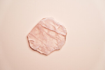 Crystal stone on pink background with copy space