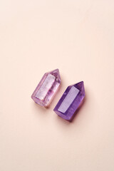 Crystal stone on pink background with copy space